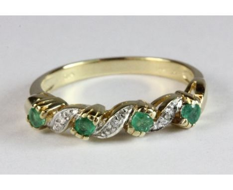 A 9ct gold emerald and diamond fancy half eternity ring, size M