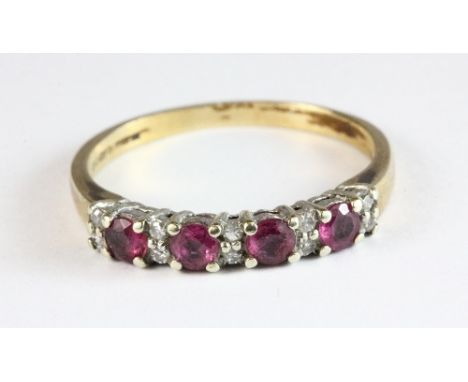 A 9ct gold ruby and diamond half eternity ring, size P