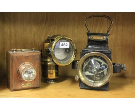 A carbide lamp and 2 others