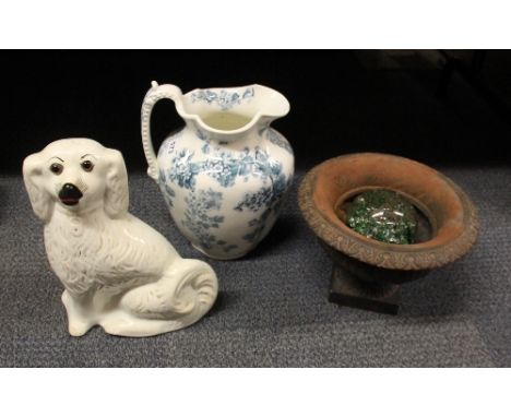 A large china jug, spaniel figure, cast iron planter and a paper weight
