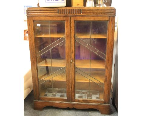 An oak and leaded glass Art Deco book case 90 x 28 x 128cm