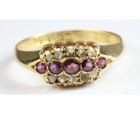 An 18ct gold ruby and diamond ring, size P.5