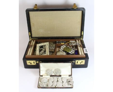 A vintage leather jewellery case containing Art Deco buckles and other vintage items