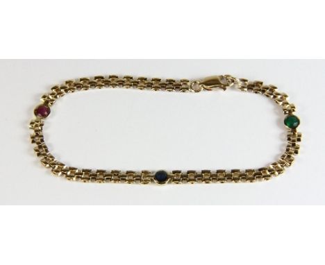 A 9ct yellow gold bracelet set with an emerald, ruby and sapphire