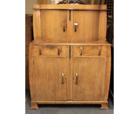 An Art Deco oak cocktail cabinet W 104cm x 48cm x 138cm