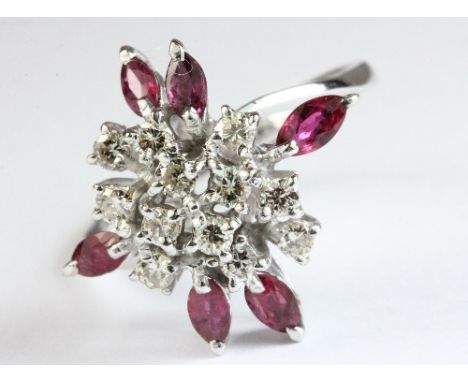 An 18ct white gold ruby and diamond cluster ring, size P