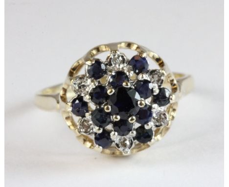 A 9ct gold sapphire and diamond cluster ring, size M.5