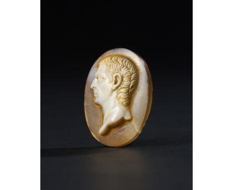 Exquisite Roman cameo, carved from sardonyx agate, features a finely detailed portrait of a male ruler, possibly an emperor o