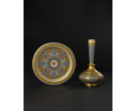 This exceptional set, consisting of a decorative porcelain plate and matching vase, is a fine example of Islamic-inspired des