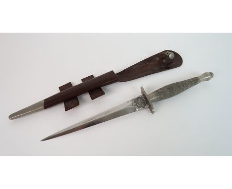 A FAIRBAIRN-SYKES FIGHTING KNIFE the blade marked "The F-S Fighting Knife" and "Wilkinson Sword Limited, London", in leather 