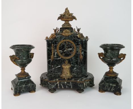 A 19TH CENTURY GREEN MARBLE CLOCK GARNITURE the clock ormolu mounted with flower encrusted tazza and birds finial, and beehiv