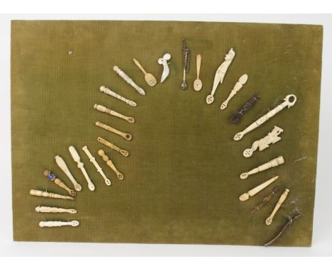 A COLLECTION OF EARLY CARVED BONE AND OTHER CADDY SPOONS of varying designs, 10cm long and smaller (27) Condition Report: Ava