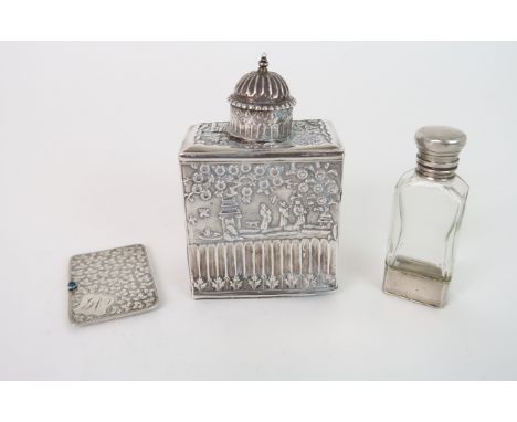 A CONTINENTAL SILVER TEA CADDY AND COVER decorated with chinoiserie above flutes and acanthus leaf, 10cm high, 74 grams, an E