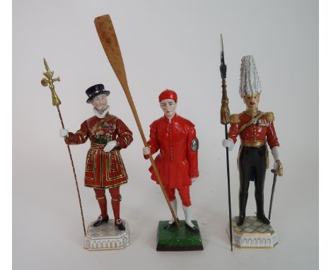 A DRESDEN FIGURE YEOMAN OF THE GUARD together with two Sitzendorf figures Waterman Dogget Winner and Gentleman At Arms (3) Co