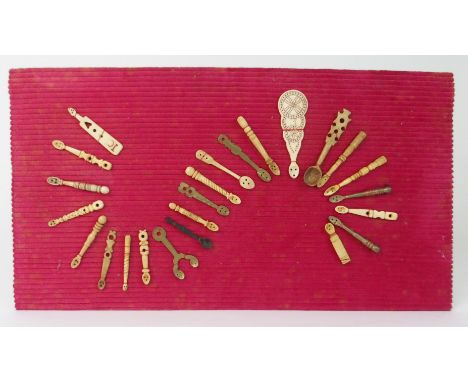 A COLLECTION OF EARLY CARVED BONE AND OTHER CADDY SPOONS of varying designs, 10cm long and smaller (24) Condition Report: Ava