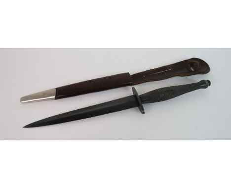 A COMMANDO DAGGER the crossguard marked with the military arrow, in leather metal tipped scabbard, 30cm overall length Condit