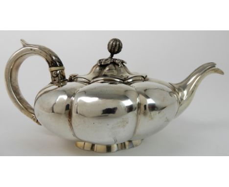 A SILVER TEAPOT possibly by Charles Corrin, London 1833, of melon shape with scrolling handle with thumbpiece, 10cm high, 339