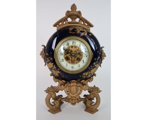 A LATE 19TH CENTURY BREVETE GILT METAL AND PORCELAIN CASED CIRCULAR CLOCK the blue ground with raised gilded decoration of fl