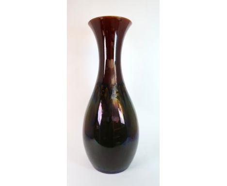 CHRISTOPHER DRESSER (1834-1904) FOR LINTHORPE POTTERY VASE the fluted neck tapering to a bulbous body, in brown and green gla