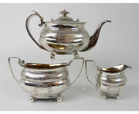 A PROVINCIAL SILVER THREE-PIECE TEA SERVICE by John Robertson II and John Walton, Newcastle 1816, of rounded rectangular form