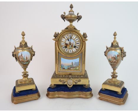 A LATE 19TH CENTURY LOUIS ACHILLE BROCOT MANTLE CLOCK AND GARNITURE the urn mounted gilded metal case with porcelain circular