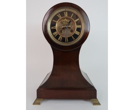 A 19TH CENTURY MAHOGANY DRUM HEAD TWO TRAIN MANTEL CLOCK with gilt Roman numerals on black ring dial, with exposed escapement