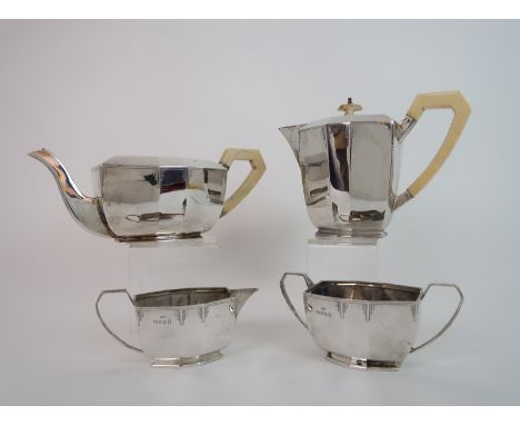 A MATCHED FOUR PIECE SILVER TEA SERVICE the teapot (missing finial), cream and sugar by Emile Viner, London 1935, the hot wat