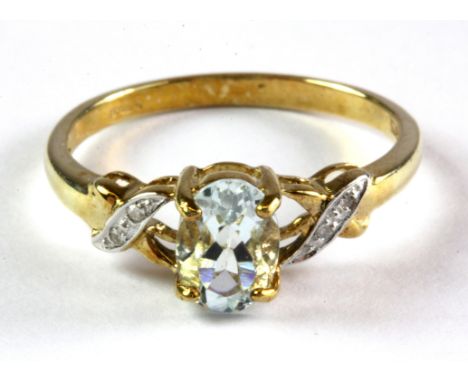 A 9ct yellow gold aquamarine and diamond set ring, (M.5).