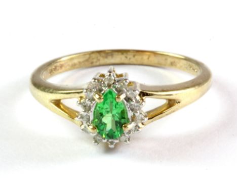 A 9ct yellow gold tsavorite and diamond set cluster ring, (L.5).