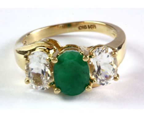 A 14ct yellow gold emerald and white stone set ring, (L.5).