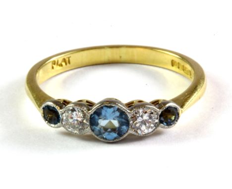 An 18ct yellow gold aquamarine and diamond set ring, (N.5).