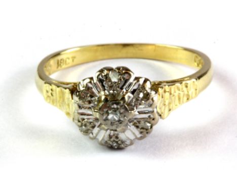 An 18ct yellow gold diamond set cluster ring, (M).