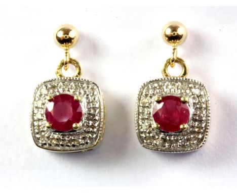 A pair of 9ct yellow gold ruby and diamond set drop earrings.