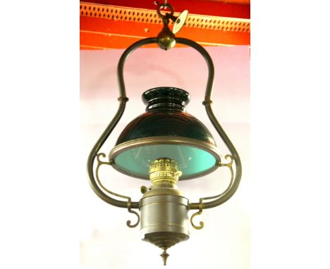 A hanging copper and brass oil lamp, H. 65cm.