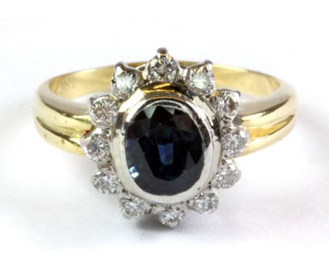 An 18ct yellow gold sapphire and diamond set cluster ring, (N).