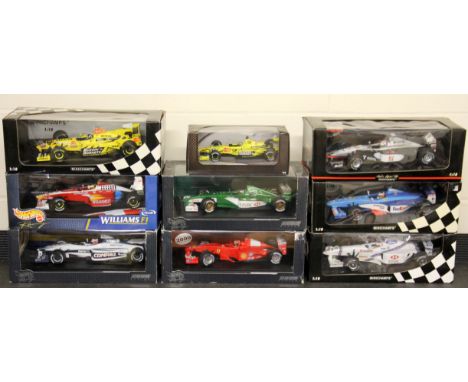 Nine large diecast model formula one racing cars, 1:18 scale