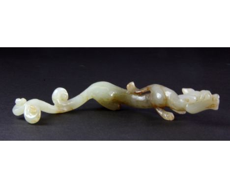 A fine Chinese carved jade figure of an elongated dragon (probably 19th Century), L. 12.5cm.