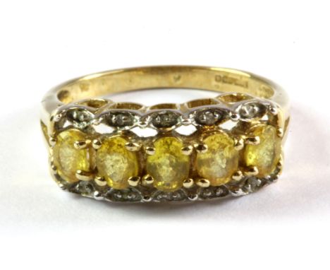 A 9ct yellow gold ring set with yellow sapphires and diamonds, (L.5).