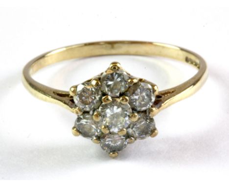 A 9ct yellow gold stone set cluster ring, (M.5).