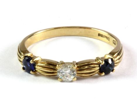 A 9ct yellow gold ring set with a brilliant cut diamond and sapphires, (P).