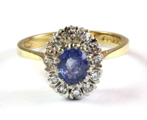 A 9ct yellow gold sapphire and diamond set cluster ring, (O.5).