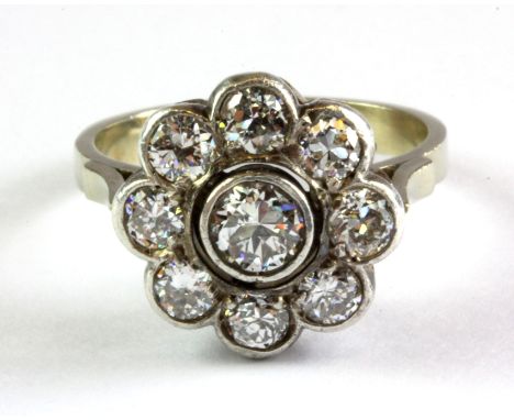 A white metal (tested 18ct gold) diamond set cluster ring, approx. over 2ct diamonds, top dia. 1.3cm, (P).