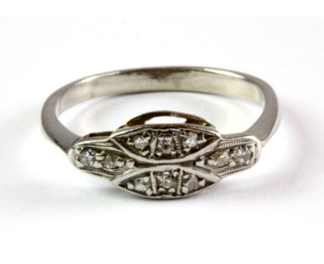 An antique white metal (tested minimum 9ct gold) diamond set ring, (N).