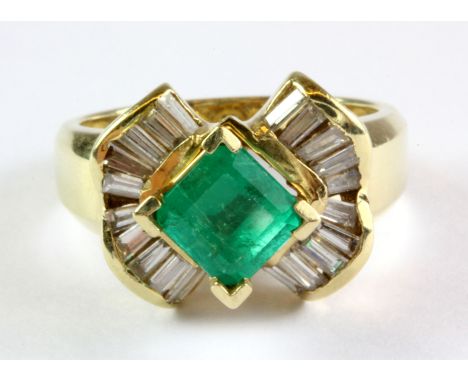 A 14ct yellow gold emerald and diamond set cluster ring, (M).