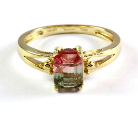 A 9ct yellow gold ring set with an emerald cut watermelon tourmaline, (K).