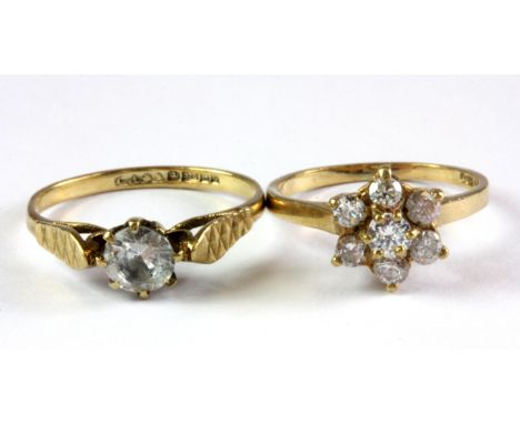 A 9ct yellow gold white spinel set solitaire ring and a further 9ct gold stone set ring, (N.5 & L).