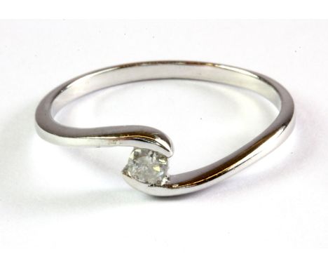 A 9ct white gold diamond set solitaire ring, (N.5).