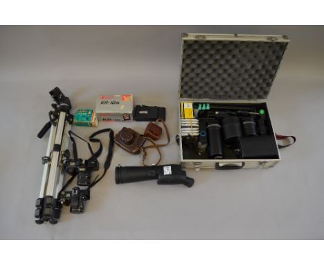 Good quantity of assorted camera equipment including vintage cameras, lenses in metal case and a tripod.
