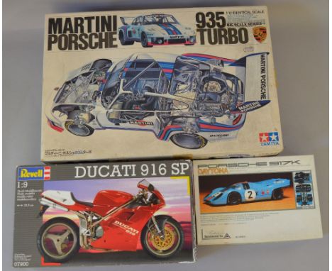3 Model Kits: Tamiya Martini Porsche 935 Turbo #1223; Union Porsche 917K Daytona and a Revell Ducati 916SP. Appear complete a