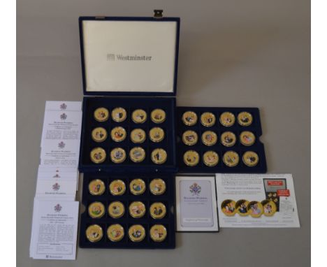 Collection of 36 Westminster Diamond Wedding Photographic Portrait coins, gold plated in display case.